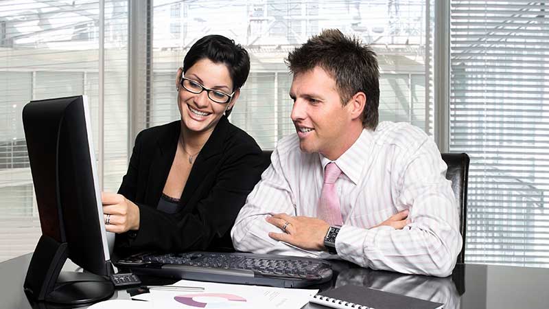 Happy Customers looking at PC screen